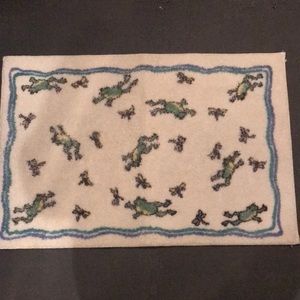 Bath mat with frogs on it